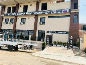 a hotel evo inn with a truck parked in front of it at As Hotel Expo Inn in Greater Noida