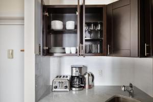 a kitchen with a counter top with a coffee maker at West Village 1br w wd nr bars restaurants NYC-1133 in New York