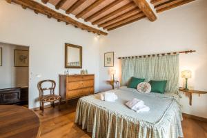 Ένα ή περισσότερα κρεβάτια σε δωμάτιο στο Casale