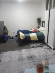 a bedroom with a bed in a room at Queensgate centre in Stifford