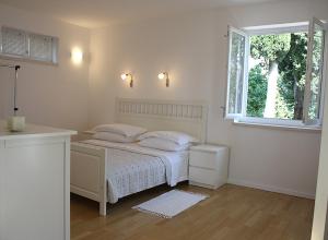 Posteľ alebo postele v izbe v ubytovaní Suncana Apartments Dubrovnik