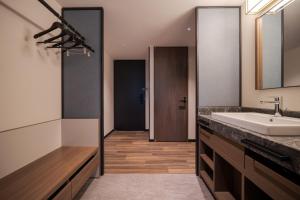 a bathroom with a sink and a mirror at Premier hotel -CABIN PRESIDENT- Tokyo in Tokyo