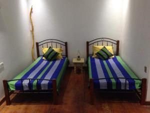 Postel nebo postele na pokoji v ubytování Lakhala Nature Resort
