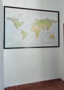 a map of the world hanging on a wall at Confy Apartments Pompei in Pompei