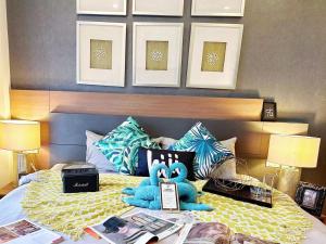מיטה או מיטות בחדר ב-The Astra Condo Changkhlan in Chiang Mai