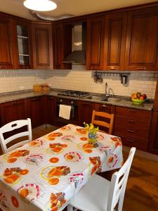 a kitchen with a table with oranges on it at Casa Diana in Scilla