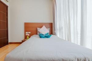 מיטה או מיטות בחדר ב-The Astra Condo Changkhlan in Chiang Mai