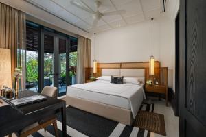 Säng eller sängar i ett rum på Taj Taal Kutir