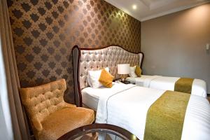 Letto o letti in una camera di The Mirah Hotel Bogor