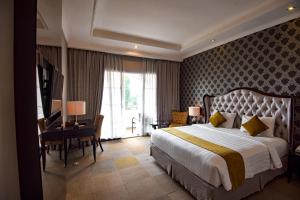 Letto o letti in una camera di The Mirah Hotel Bogor