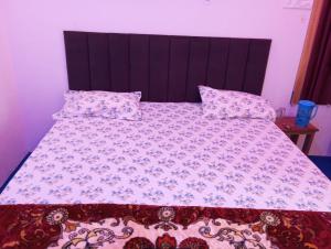 Ένα ή περισσότερα κρεβάτια σε δωμάτιο στο Atithi home stay and Cloud Kitchen