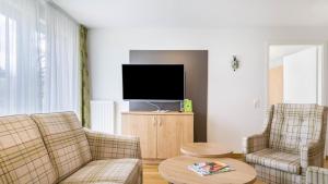 TV a/nebo společenská místnost v ubytování Haus am Krummbach