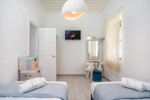 Postel nebo postele na pokoji v ubytování Lady Stamatias House