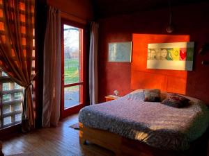 Кровать или кровати в номере Villa di design nelle colline della Valsesia