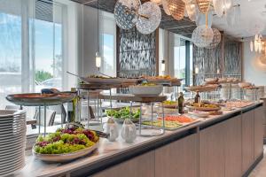 a buffet line with a lot of food on display at GRANO HOTEL Solmarina in Wiślinka