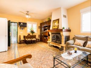 a living room with a couch and a fireplace at Cortijo Valmaruc in Dúrcal