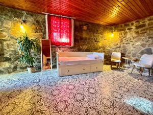 a bedroom with a bed and a table and chairs at Cagla Hotel in Ildır