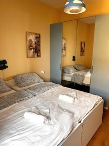 a bedroom with a large bed with towels on it at Casa Diana in Scilla