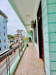 a balcony of a building with a view of a city at Thanh Lam Hotel in Sầm Sơn
