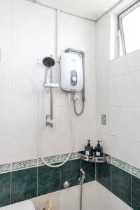 a shower in a bathroom with a shower at PortDickson Minimalist Seaview Home 10Pax3BR 1MinToBeach in Port Dickson