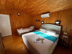 Postel nebo postele na pokoji v ubytování Garden Pansiyon Çıralı