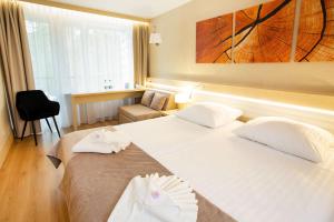 Postel nebo postele na pokoji v ubytování Hotel Orle