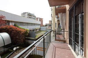 an apartment balcony with a view of a street at Forlanini - Functional Studio with Balcony! in Milan