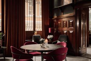 a dining room with a table and chairs at Opus 16 in Bergen