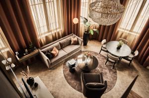 a living room with a couch and a table at Opus XVI, a member of Small Luxury Hotels of The World in Bergen +95 photos