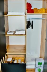 a walk in closet with wooden shelving at ESCAPE in Zăbala