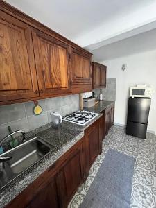 A kitchen or kitchenette at In piazzetta a Nervi