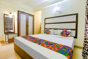 a bedroom with a large bed in a room at Via Jesant Valley Resort - Nr Candolim Beach in Candolim
