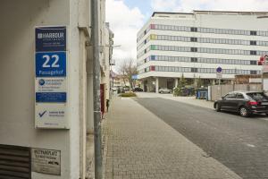 a sign on the side of a building on a street at Harbour Apartments in Karlsruhe