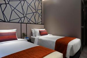 Postel nebo postele na pokoji v ubytování Hotel Boss