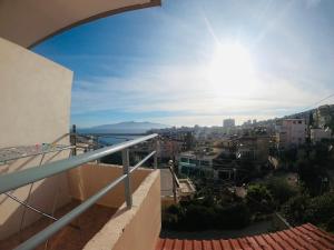 a view of a city from a balcony at Sea view Sarande in Sarandë