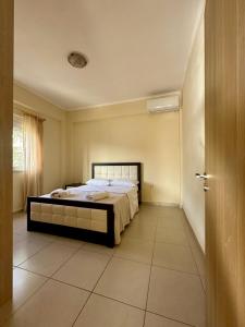 a bedroom with a bed in a room at Sea view Sarande in Sarandë