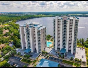 an aerial view of two tall buildings next to a river at Blue Heron Beach Resort in Orlando