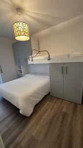 Двухъярусная кровать или двухъярусные кровати в номере La Dépendance