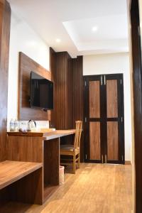 Sjónvarps- og/eða afþreyingartæki á Dees Boutique Hotel