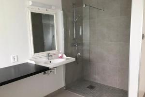 a bathroom with a sink and a shower at Store Ringheim Apartment - Villa Solberg in Vossevangen +33 photos