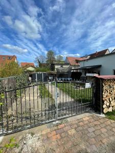a metal fence in front of a house at Buri`s Seenlandhaus in Hoyerswerda