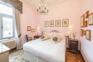 Posteľ alebo postele v izbe v ubytovaní Chateau Mcely