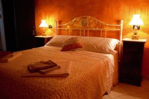 Postel nebo postele na pokoji v ubytování Agriturismo Il podere + 10 fotografií