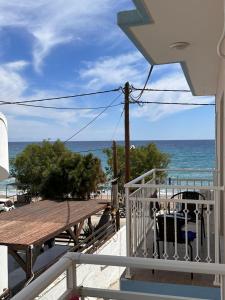 a view of the ocean from the balcony of a house at Stegna Sea & Sun in Archangelos