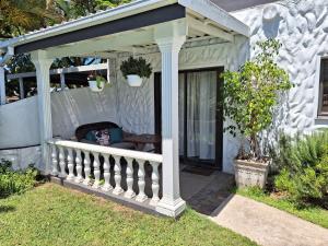 a gazebo on the side of a house at Umuzi Guest House in Richards Bay