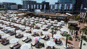an overhead view of a beach with chairs and umbrellas at Hotel Building Stefan Resort I in Mamaia Nord