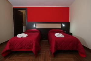 Postel nebo postele na pokoji v ubytování Hotel Paradiso