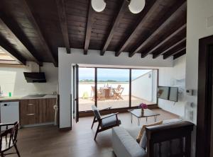 a living room with a view of the ocean at LA LÍNEA DEL MAR in Trasierra