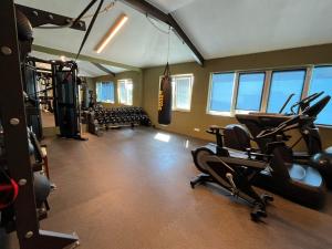 a gym with two treadmills and a gym withwindows at Dela in Hvar