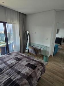 Ένα ή περισσότερα κρεβάτια σε δωμάτιο στο Royal Blu Haven: Luxurious Self-Catering Residences at Radisson Blu Umhlanga +10 φωτογραφίες